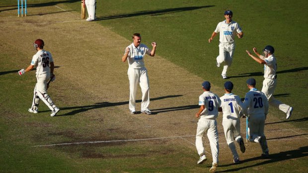 Doug Bollinger of the Blues celebrates after taking the wicket of Nathan Reardon of the Bulls.