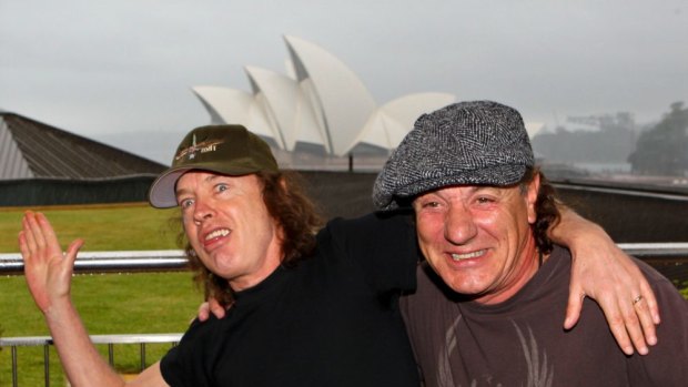 Angus Young on tour with Brian Johnson and AC/DC in happier times.