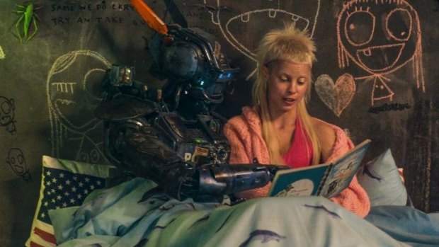 A tender moment amid the madness: Yolandi Visser of Die Antwoord with Chappie.