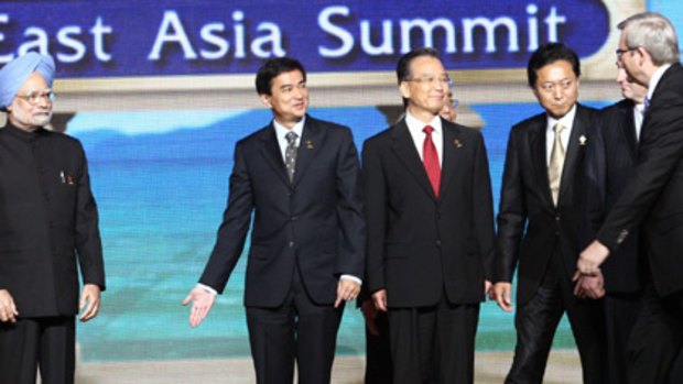 Just stand here ... Kevin Rudd joins other leaders for a photo at the East Asia Summit.
