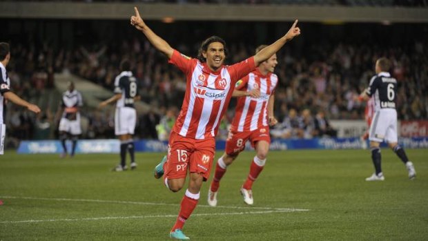The Melbourne Heart's David Williams celebrates scoring against Melbourne Victory in the A-League opener.