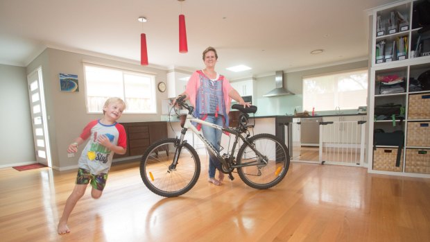 Rachael Earwaker in her decluttered home with her son, Sam.