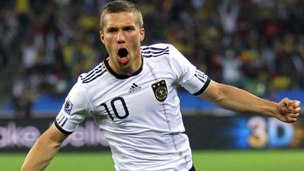 Early blow ... Lukas Podolski celebrates scoring Germany's opening goal after only nine minutes.