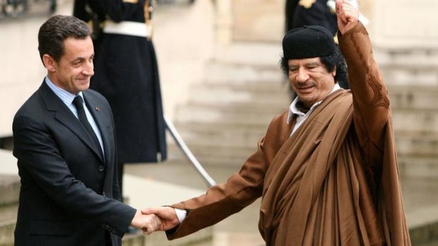 French President Nicolas Sarkozy with former Libyan leader Muammar Gaddafi during the late dictator's visit to Paris in 2007.