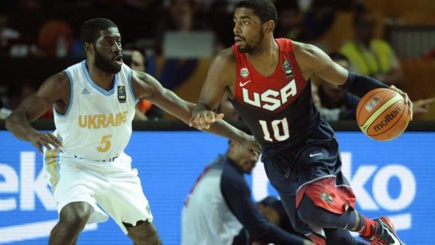 Australian-born Kyrie Irving (R) vies with Ukraine's guard Eugene "Pooh" Jeter during Team USA's win in their final pool game.