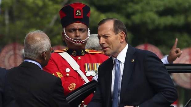 Pomp and circumstance: Tony Abbott arrives at the Commonwealth Heads of Government Meeting opening ceremony in Columbo.