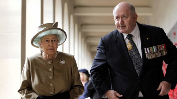 High profile: The Queen with General Peter Cosgrove, who admits he likes the limelight.