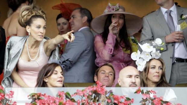 Crowd pleaser: Sarah Jessica Parker, Shane Warne and Elizabeth Hurley watch Mosheen win the 2011 Crown Oaks from the Chairman's Box.