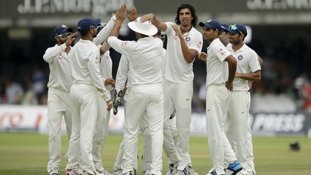 Ishant Sharma celebrates with teammates after taking the wicket of England's wicketkeeper Matt Prior, caught by Murali Vijay (fourth from right) on the final day of the second Test at Lord's on Monday.