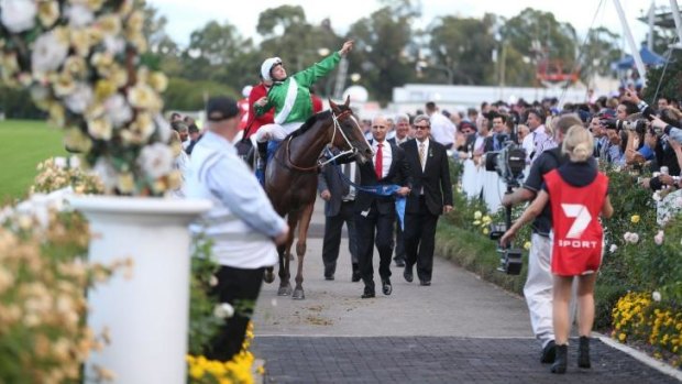 Off and racing: James McDonald celebrates victory in this year's Golden Slipper on Mossfun. Channel Seven is expanding its involvement in racing.