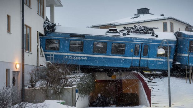 Runaway train ... a cleaner stole a train and crashed it  into a residential building.