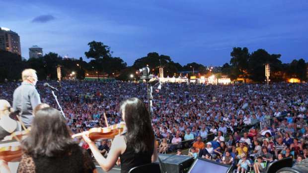 Outsiders ... a huge crowd attends Symphony in The Domain last year.