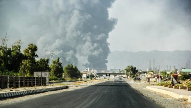 A column of smoke rises from an oil refinery in Beiji, some 250 kilometres north of Baghdad, Iraq, after an attack by Islamic militants. 