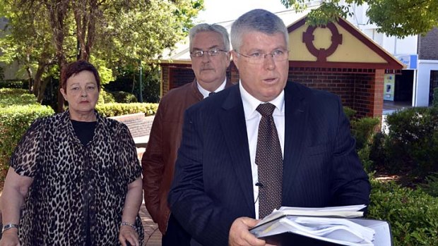''Truly, there are no winners here'' &#8230; Philip Cameron and his wife look on as solicitor Mark Daly reads a prepared statement.