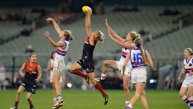 Good grab: Chelsea Randall takes a strong mark for Melbourne but will be a marquee player for Adelaide next year.
