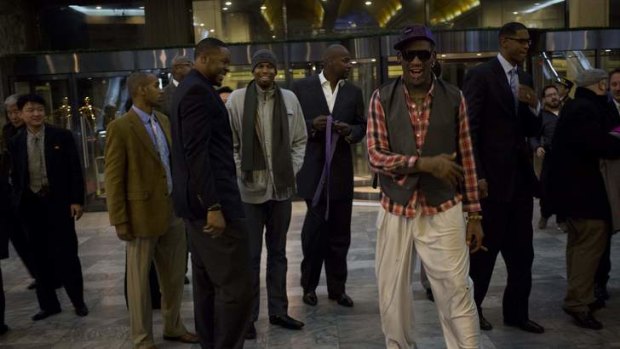 Former NBA basketball star Dennis Rodman and fellow U.S. basketball players arrive at a hotel in Pyongyang, North Korea after returning from an official dinner on Monday.