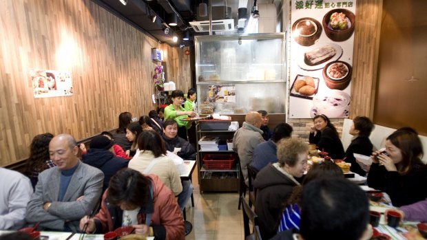 Customers eat at Tim Ho Wan 32-seat restaurant in Hong Kong.