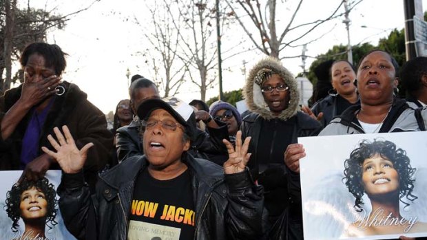 Fans attend a Whitney Houston Leimert Park Vigil in California.