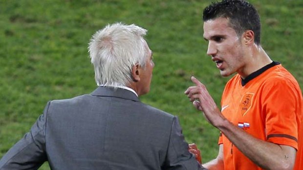 Heated discussion ... Robin van Persie is taken off against Slovakia by coach Bert Van Marwijk