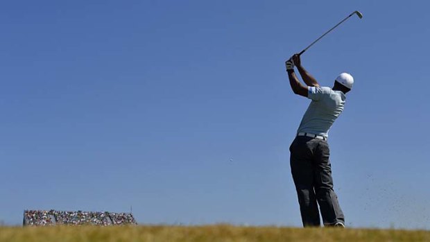 Clinical: Tiger Woods tees off on the 16th on Friday.
