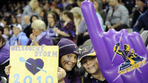 Winning smiles ... loyal fans keep the faith at last night’s game.