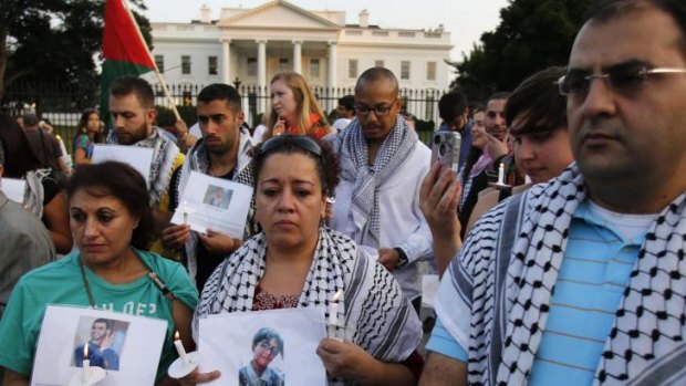 Silent candlelit vigil: The American-Arab Anti-Discrimination Committee and other activists in front of the White House on Wednesday.