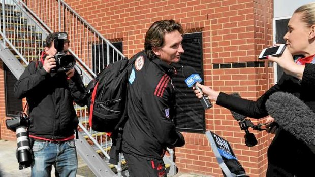 Essendon coach James Hird speaks to waiting media at Windy Hill on Tuesday afternoon.