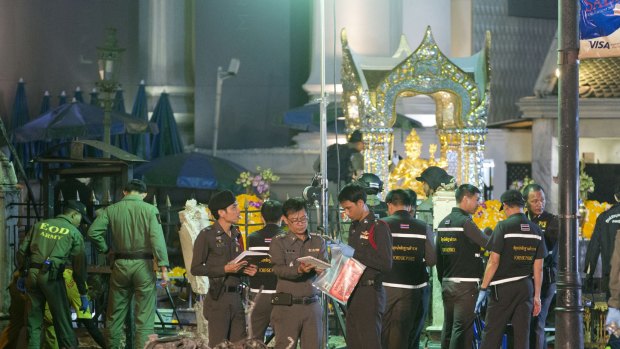 Police investigate the scene at the Erawan Shrine after an explosion in Bangkok, Thailand, on August 17.