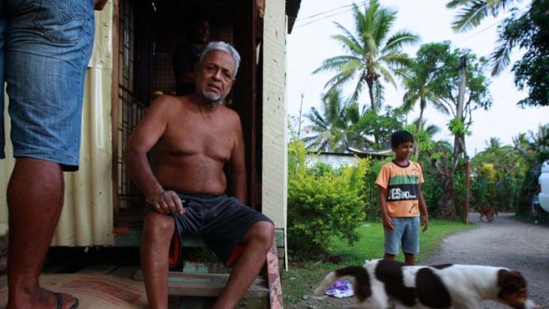 Supportive ... Vijay, a resident of the Nanuku settlement, with his grandson, Aryan, 8. Vijay says the coup government has helped give more security to Indian-Fijians.