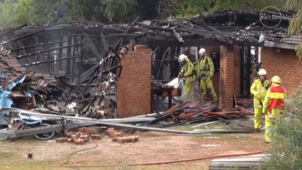 Firefighters extinguish the blaze at a Hovea home after a gas explosion.