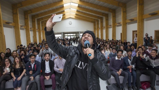 British comic Humza Arshad takes a selfie with students at Lampton School in Hounslow in London in April. A practising Muslim with a sizable YouTube following, Arshad has been using comedy to counter radicalisation and has worked with counterterrorism authorities despite the risks. 