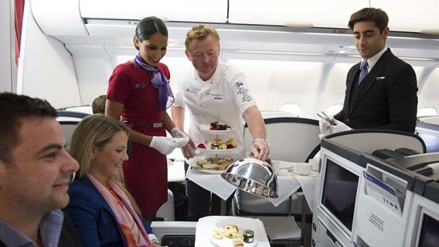 Luke Mangan surprises passengers on board a Virgin flight on Monday.