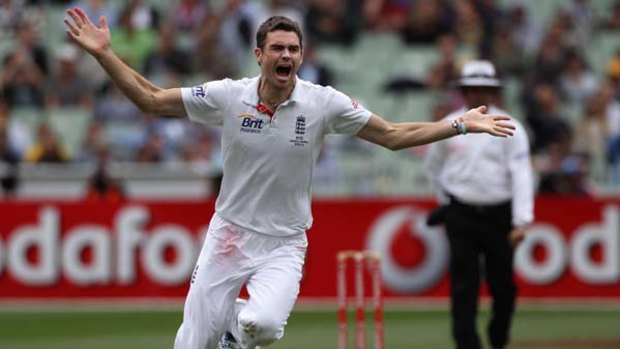 In the swing ... England's James Anderson, who showed superb control to remove four batsmen yesterday, celebrates the key wicket of Mike Hussey.