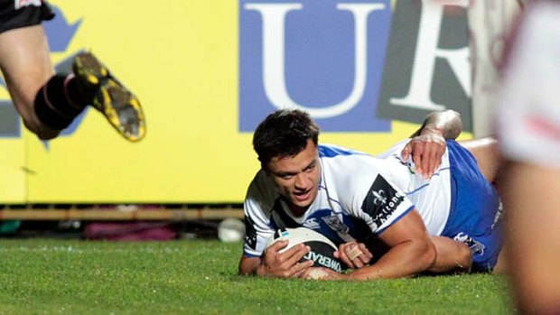 Opening his account ... former Rooster Sam Perrett scores his first try for his new club.