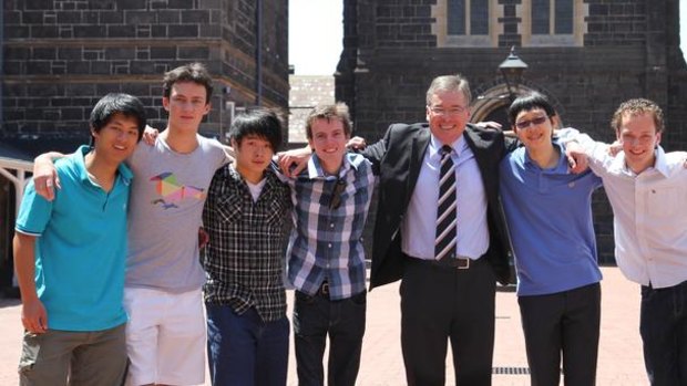 Melbourne Grammar's seven top VCE scorers: From left, Bernard Shan, Walter Myer, Nicholas Tang, Cameron Venus, Headmaster Roy Kelley, Colin Lu, Fergus Peace and Henry Li.