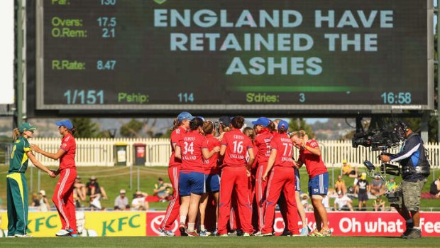 England celebrates after winning the match and retaining the Ashes during game one of the Twenty20 series between Australia and England.