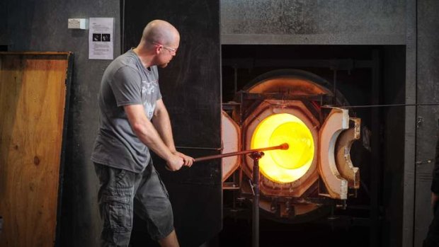 Glass artist Brian Corr at work at the Canberra Glass Works.