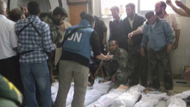 High emotion &#8230; UN observers at a morgue after the massacre of more than 92 people, including 32 children, in the town of Houla.