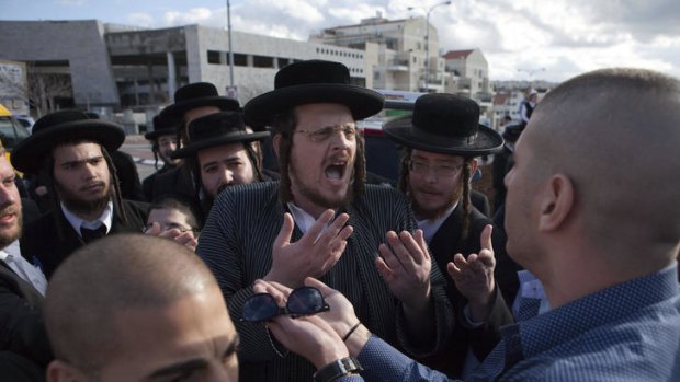 Secular Israelis argue with ultra Orthodox Jewish protesters in the central town of Beit Shemesh, near Jerusalem.