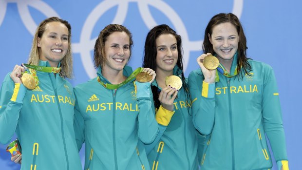 Australia's Emma McKeon, Bronte Campbell, Brittany Elmslie and Cate Campbell show off their 4x100m freestyle gold medals. 