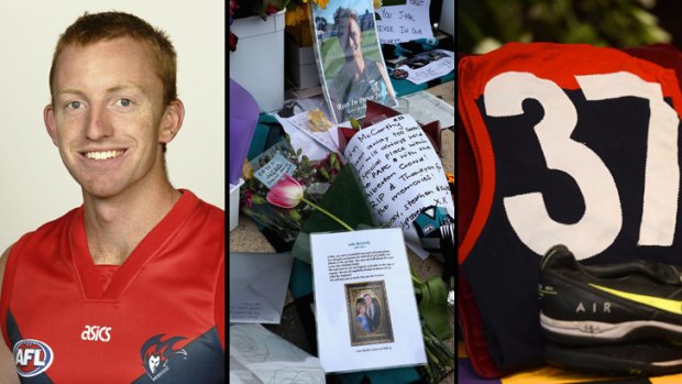 Lest we forget: Troy Broadbridge, flowers for Port Adelaide player John McCarthy, and Jim Stynes' Melbourne jumper and boots at his state funeral.