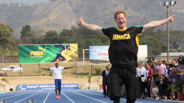 Prince Harry leaves Usain Bolt in his wake as he races him at the Usain Bolt Track at the University of the West Indies.