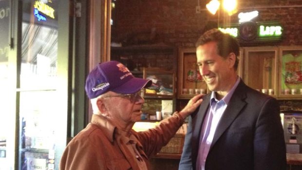 Caught on a smart phone ... Rick Santorum at Mama's Oyster House with a veteran known as Mr George.