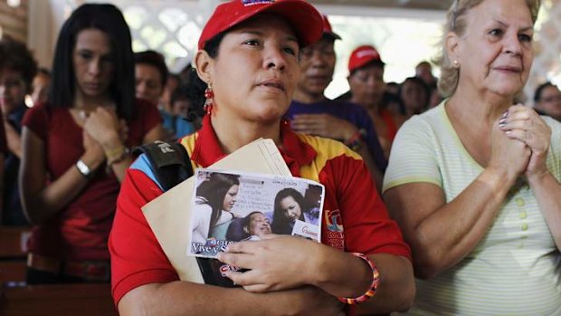 Supporters of Venezuelan President Hugo Chavez pray in a chapel outside the Caracas military hospital in Caracas.