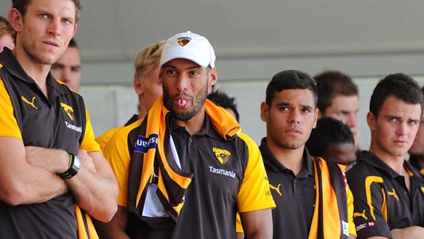 Josh Gibson pokes out his tongue during Hawthorn's jumper presentation at the club family day at Glenferrie Oval last week.