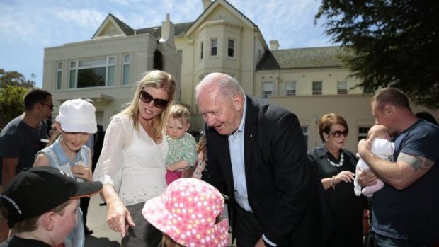 Governor-General Peter Cosgrove meets, rear from left, Paris Morris 12, Catherine Morris, Eleana Campbell, 1, front from left, William Campbell, 5, and Amity Morris, 7, during the Government House open day. Lady Lynne Cosgrove can be seen in the background in black.