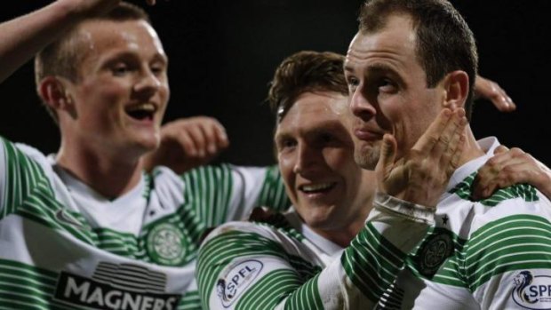 Job done: Anthony Stokes (R) celebrates his second goal for Celtic with Liam Henderson (L) and Kris Commons.