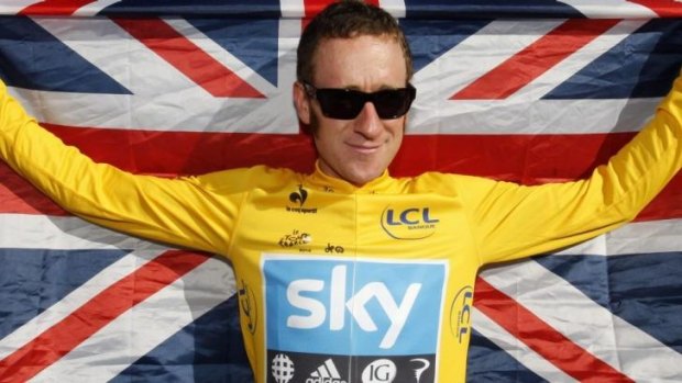 British cyclist Bradley Wiggins proudly displays his national flag.
