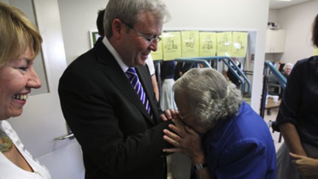 Welcome visitor ... a woman greets Mr Rudd on a visit to Ryde Hospital with the Labor MP Maxine McKew yesterday.