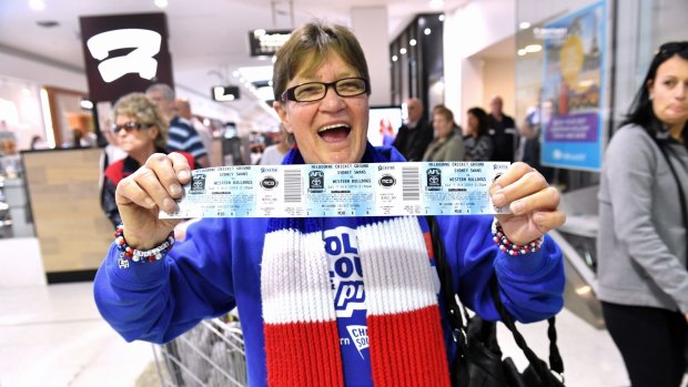 Footscray fanatic Irene Chatfield with her grand final tickets. 